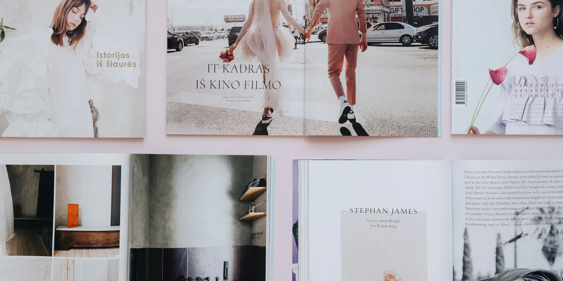 Printed brochures and magazine spreads laid out side by side