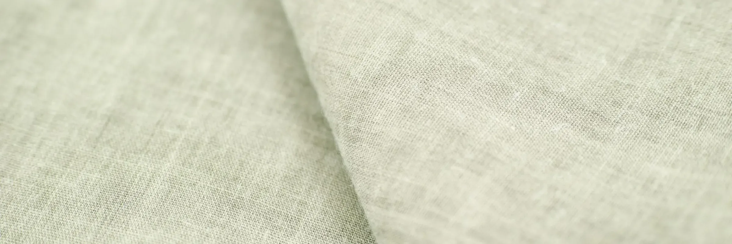 The close weave of a natural linen fabric