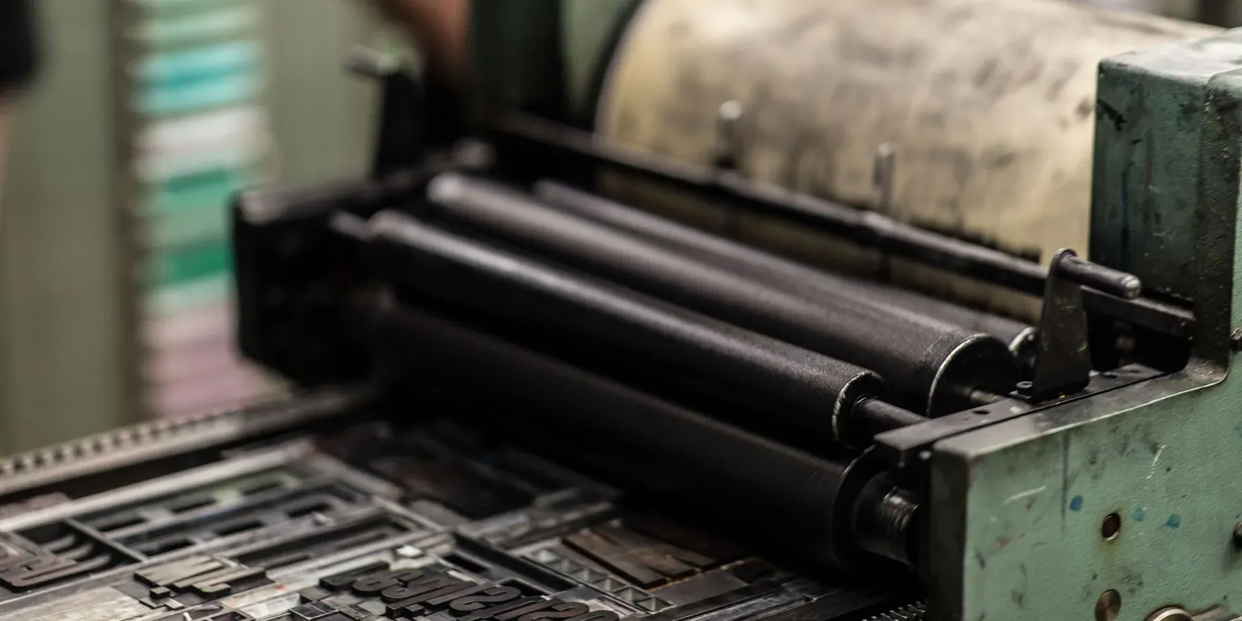 The inked rollers of an offset printing press