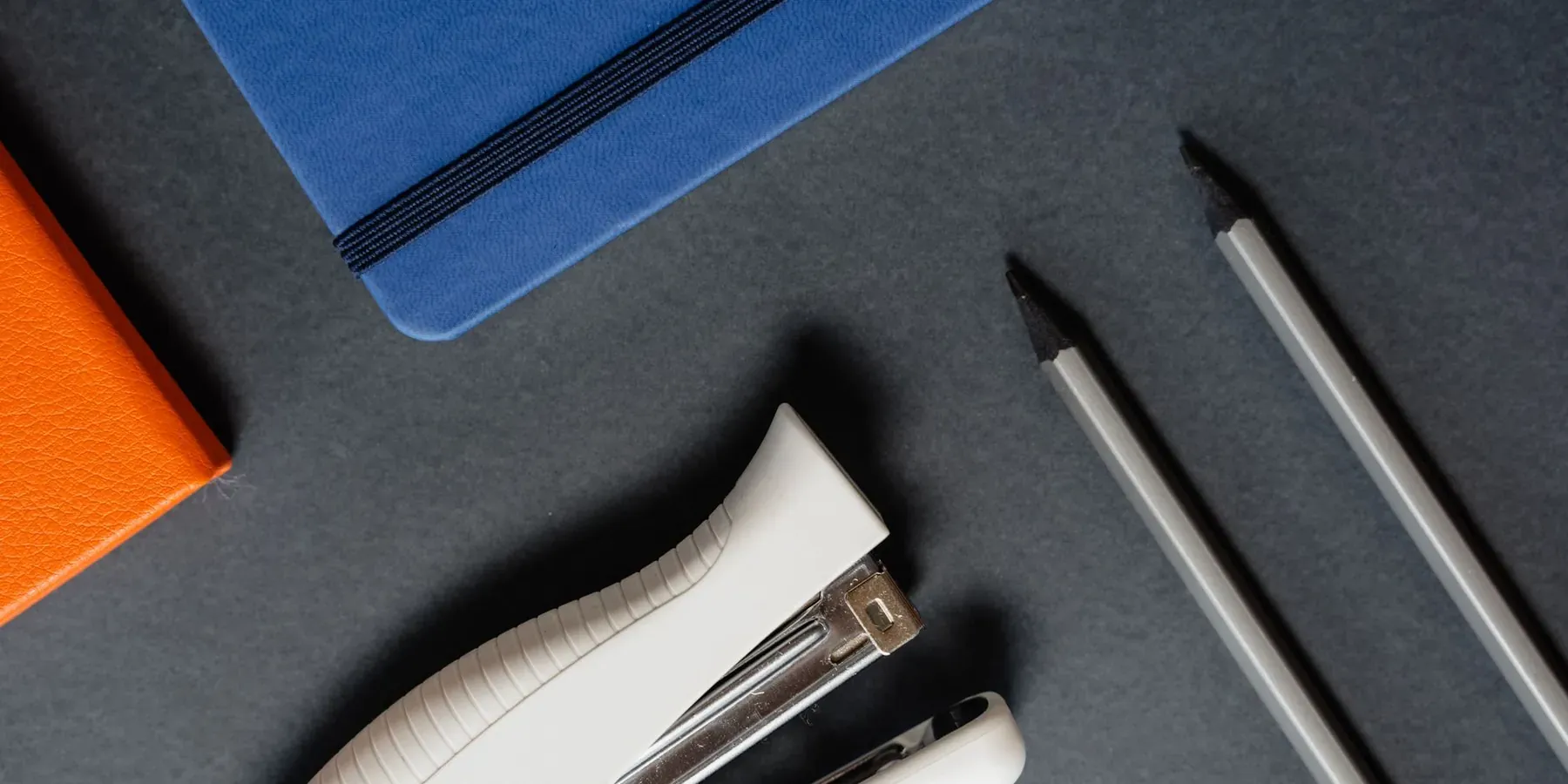 Notebooks, pens and desk accessories of the kind used for branded promotional sets