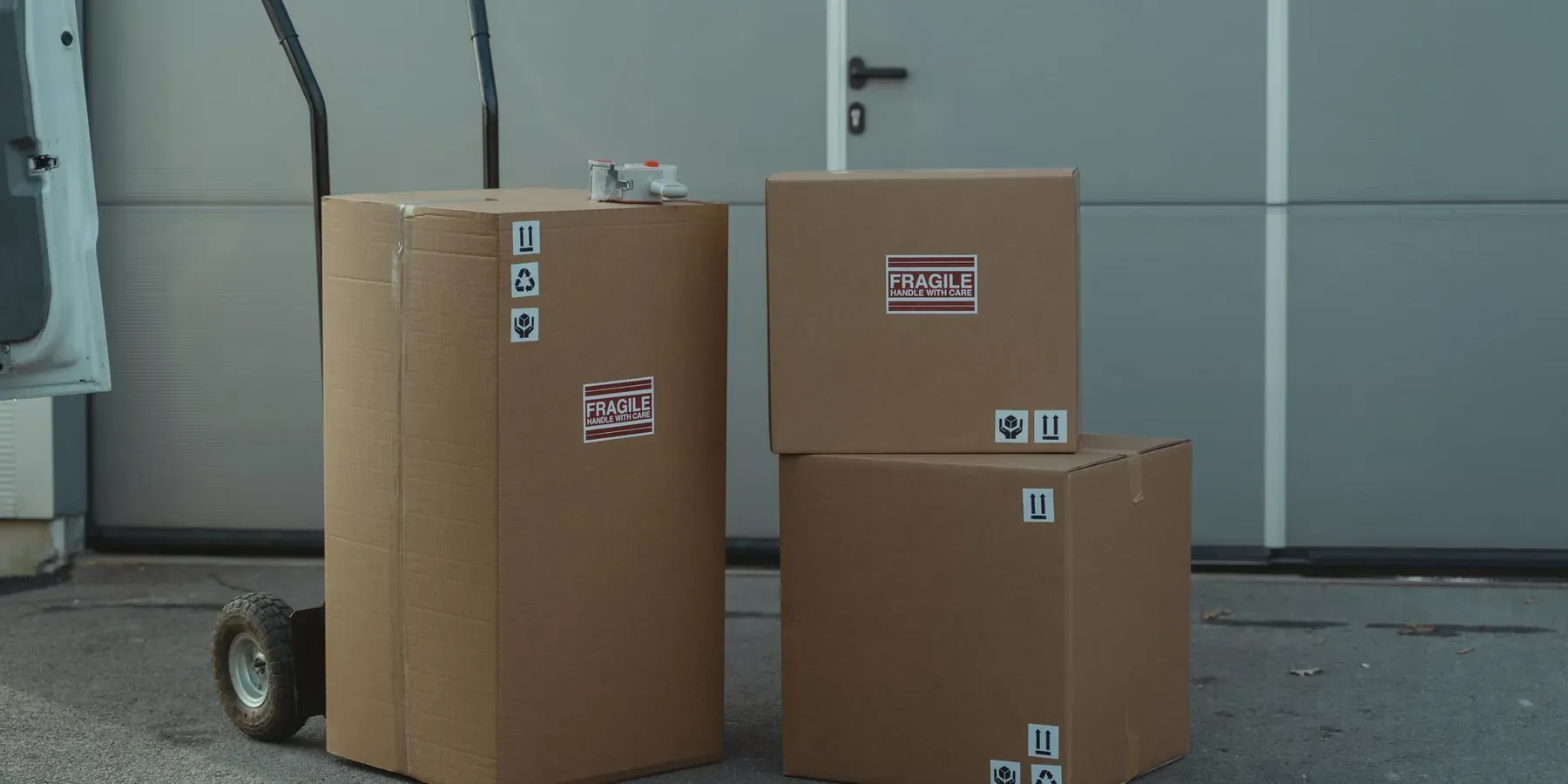 Packed cartons on a dolly, ready to ship